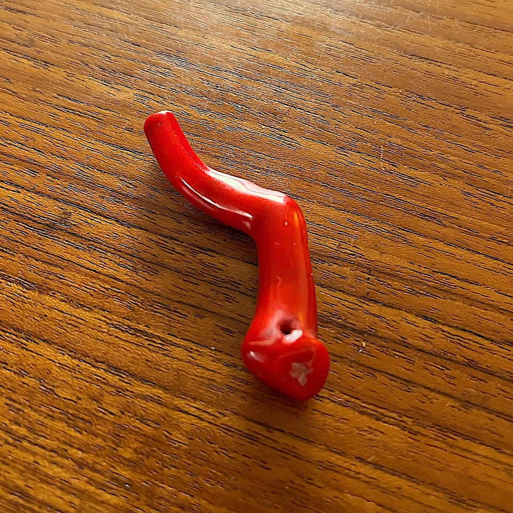 Red Coral Approximately 2.5 inches in length.